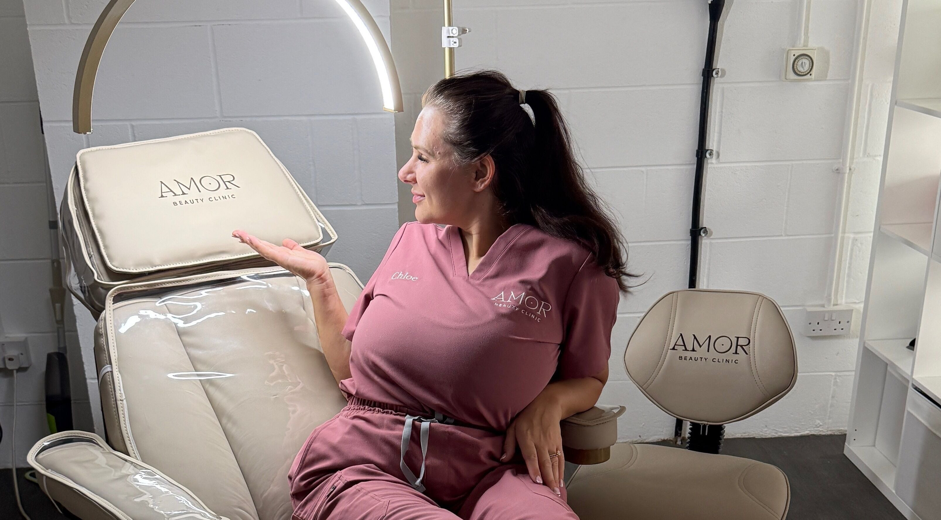Professional at Amor Beauty Clinic in Peterborough, England, relaxing in a treatment chair.