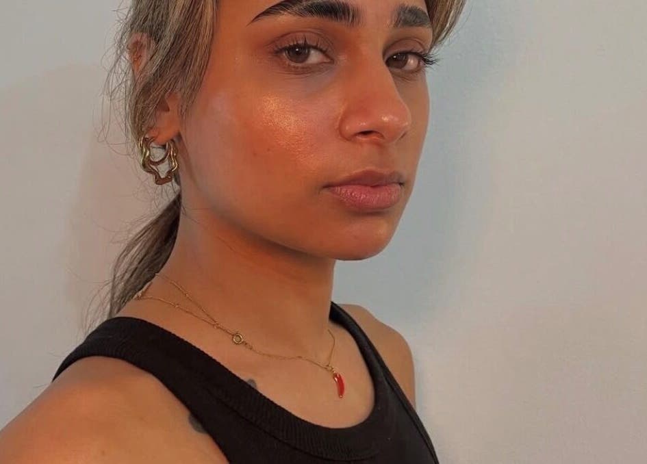 Model showcasing radiant skin and bold brows at Brow Capital, London, England, GB.