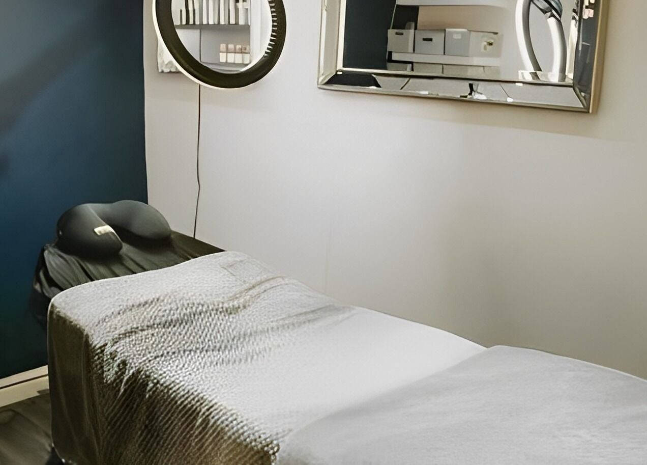 Tranquil treatment room at Bethan Sian, Malton, featuring a massage table and elegant decor. Located in Malton, England, GB.
