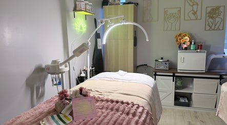 Spa treatment room at Sunshine Aesthetics in Roseville, Minnesota, US featuring a cozy setup and modern lighting.