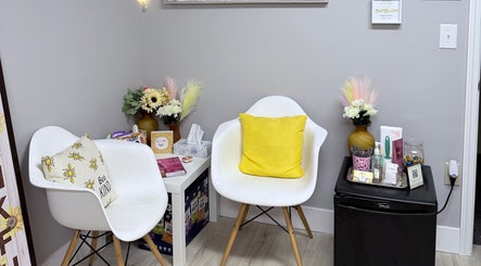 Cozy waiting area at Sunshine Aesthetics with chairs and decor in Roseville, Minnesota, US.