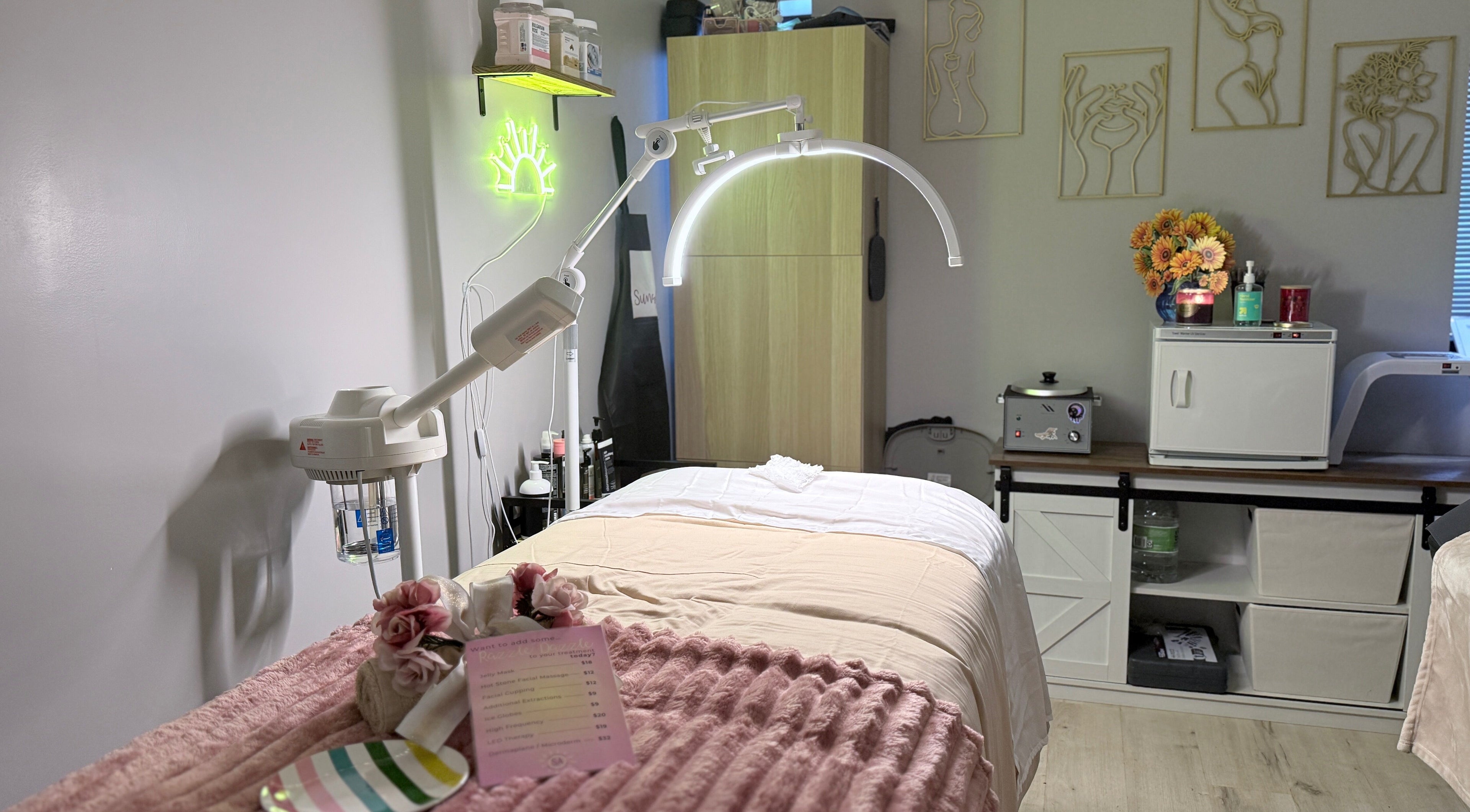 Relaxing spa room at Sunshine Aesthetics in Roseville, Minnesota, US, featuring a treatment bed and calming decor.