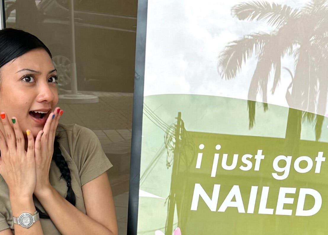 Excited woman with colorful nails at Kaia Experience G Village, Kuala Lumpur, Wilayah Persekutuan Kuala Lumpur, MY.