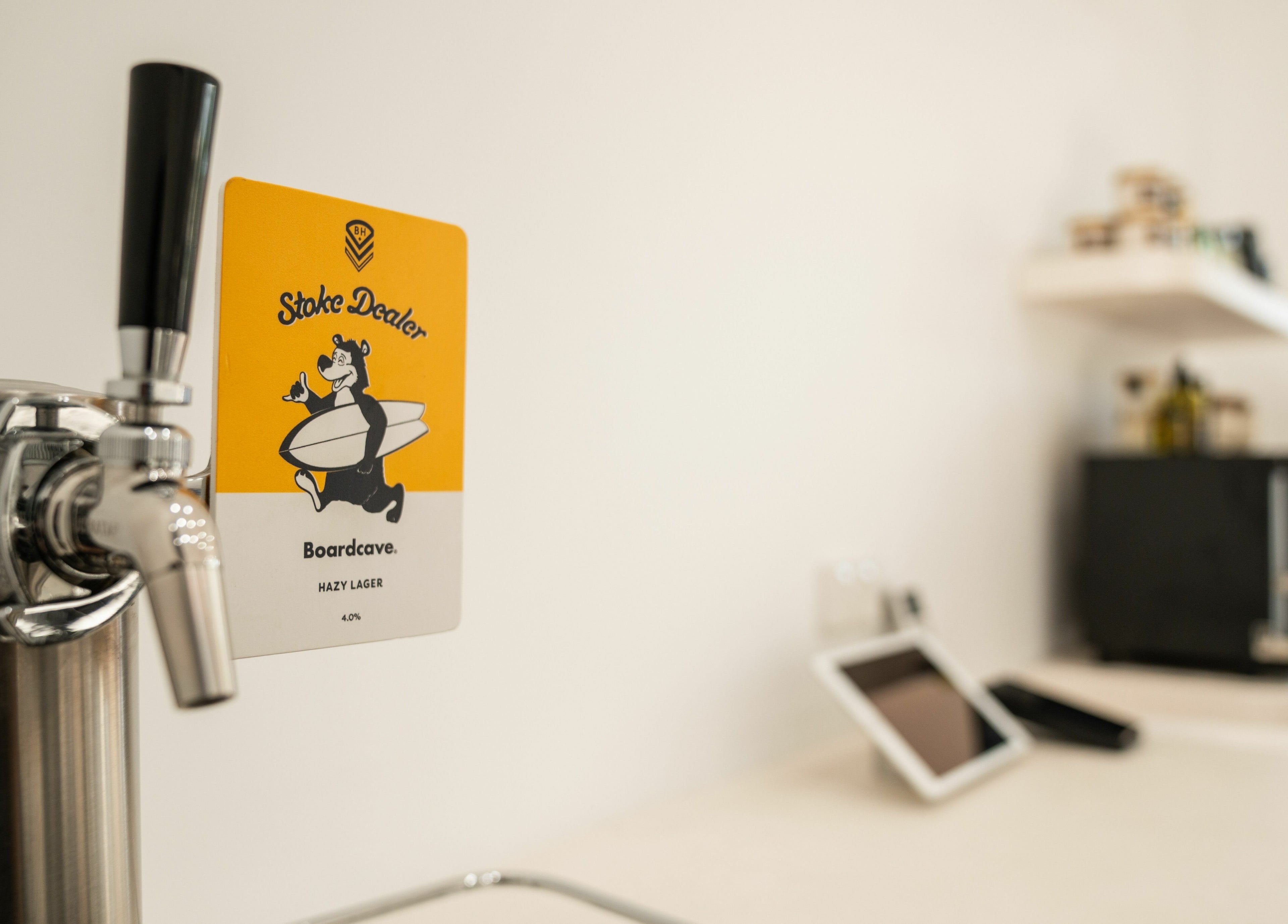 Close-up of a beer tap featuring Stoke Dealer lager at Lost Boys Burleigh, Burleigh Heads, Queensland, AU.