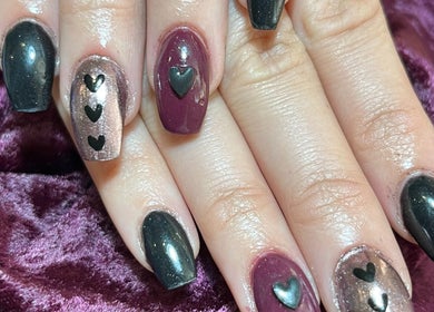 Elegant heart nail art at Cruella De Nails, Langebaan, Western Cape, ZA. Stylish manicure with black accents.