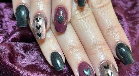 Elegant heart nail art at Cruella De Nails, Langebaan, Western Cape, ZA. Stylish manicure with black accents.