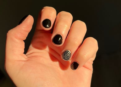 Stylish black nails with spiral design at Cruella De Nails, Langebaan, Western Cape, ZA.