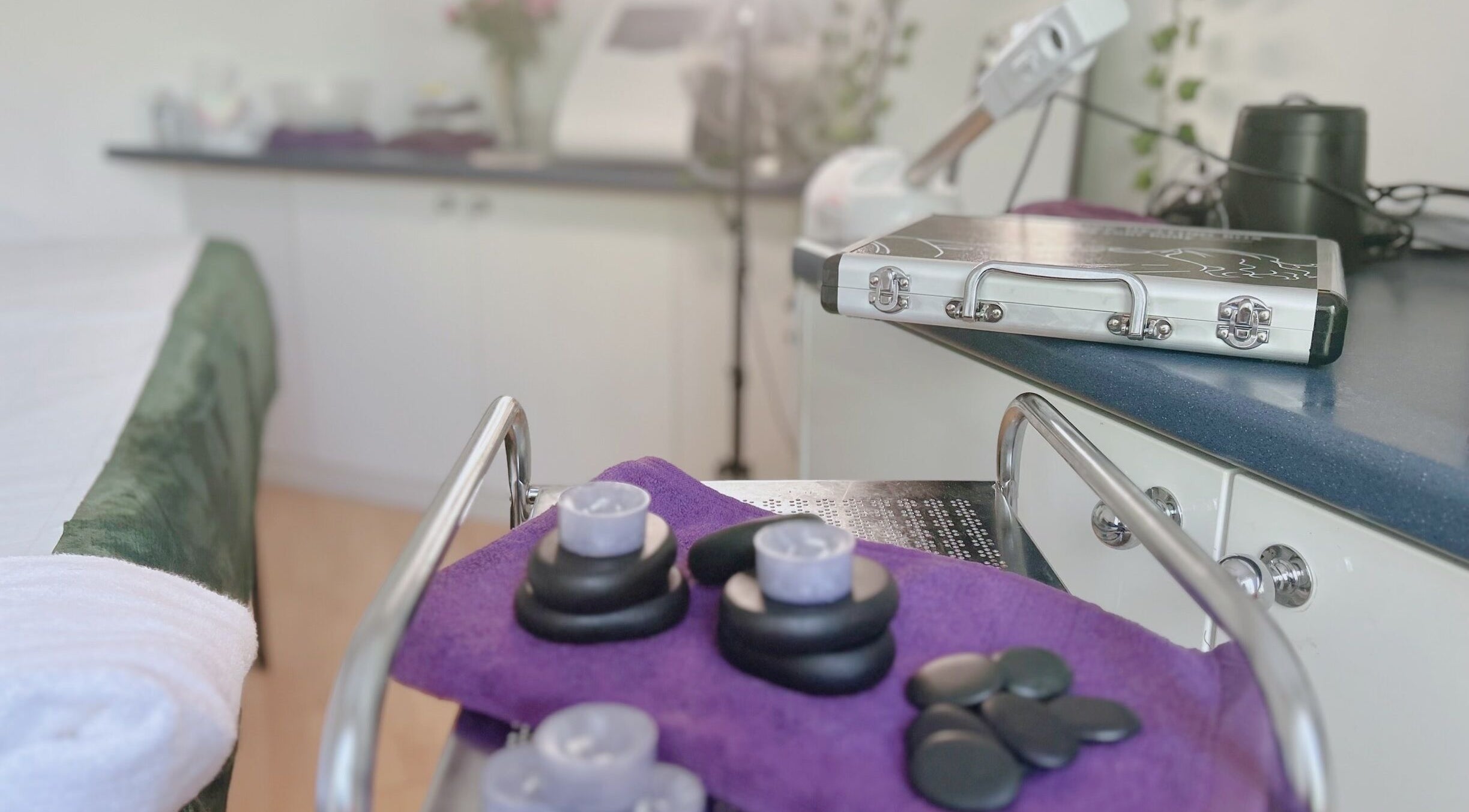 Relax Beauty massage room in Shirley, England with hot stones on a tray for a soothing experience.