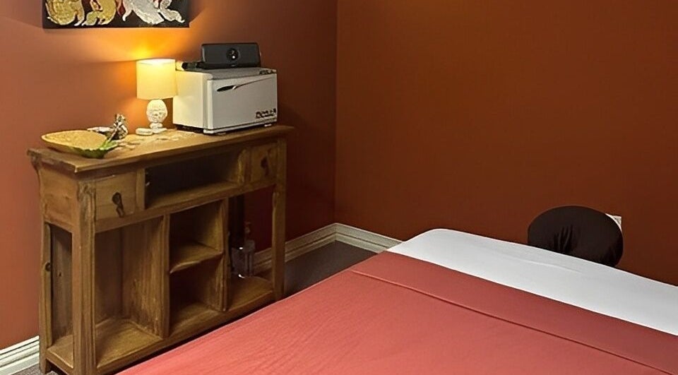 Relaxing massage room at Erawan Thai Massage - Frisco, Frisco, Texas, US with a warm, inviting decor.