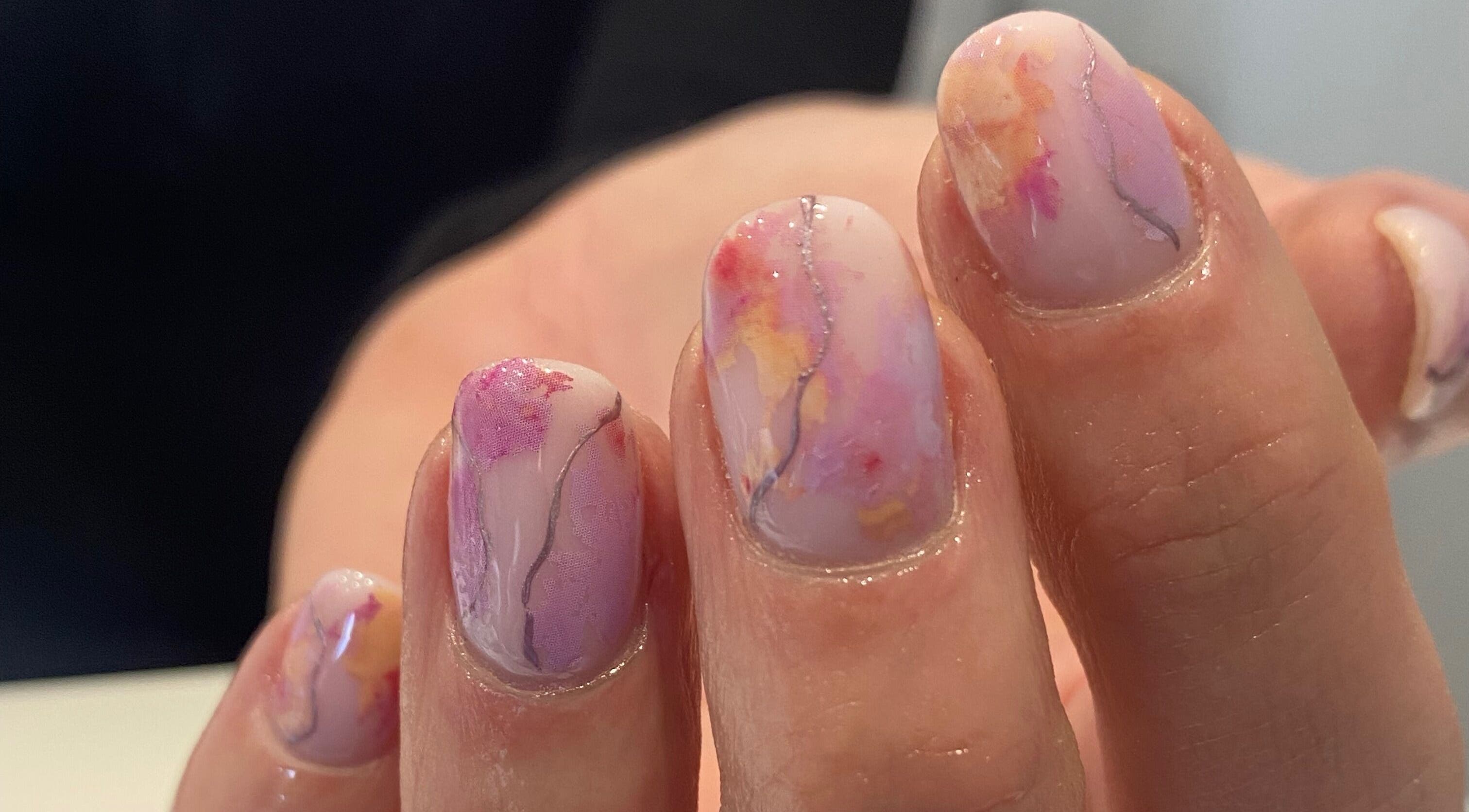 Elegant floral nail art by Beauty by Meg in Halifax, England, GB, showcasing delicate pastel watercolors.