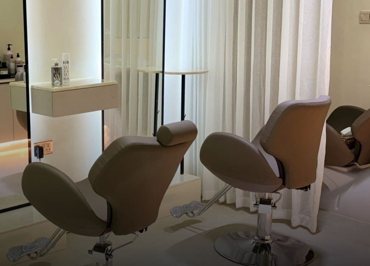 Elegant salon chairs at Ray Spa Beauty Center, Al Ain, Abu Dhabi, AE, offering luxurious beauty treatments.