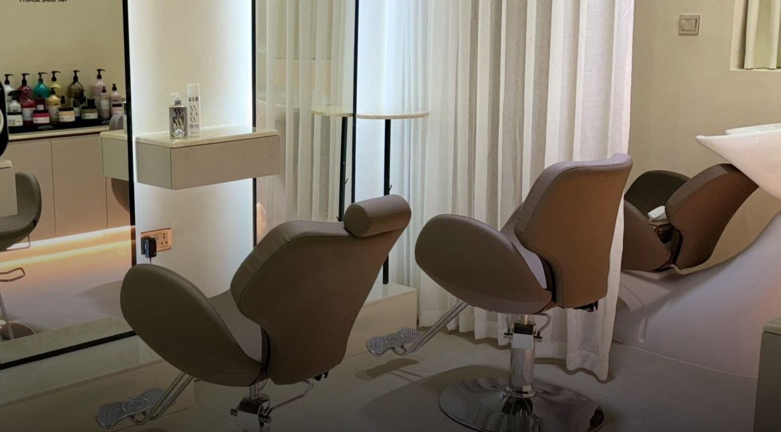 Elegant salon chairs at Ray Spa Beauty Center, Al Ain, Abu Dhabi, AE, offering luxurious beauty treatments.