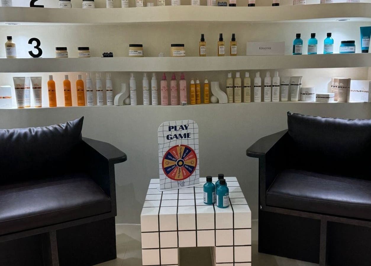 Cozy seating area at Ray Spa Beauty Center in Al Ain, Abu Dhabi, AE with elegant beauty products displayed.