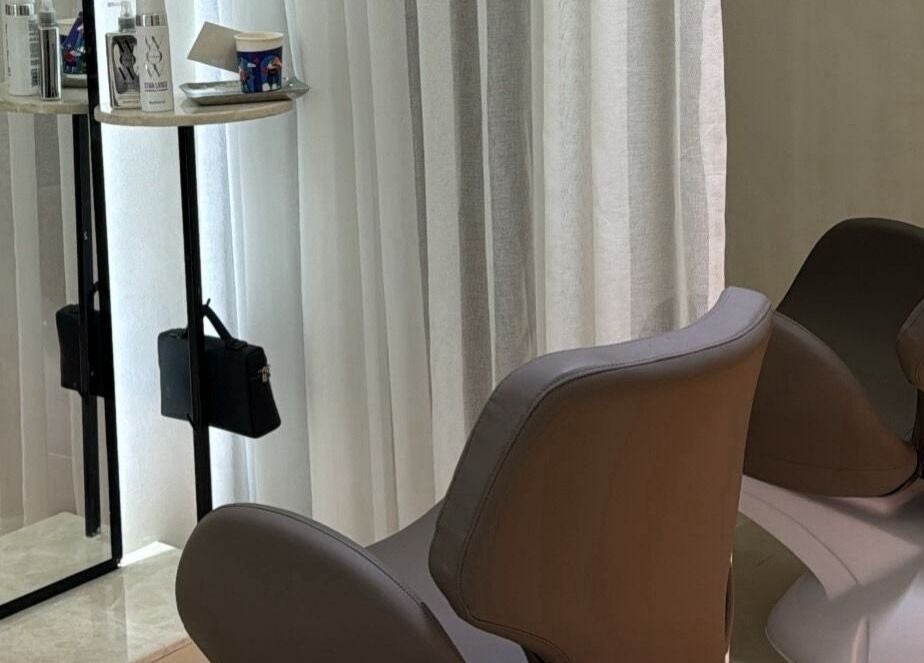 Stylish salon chair at Ray Spa Beauty Center in Al Ain, Abu Dhabi, AE, offering premium beauty services.