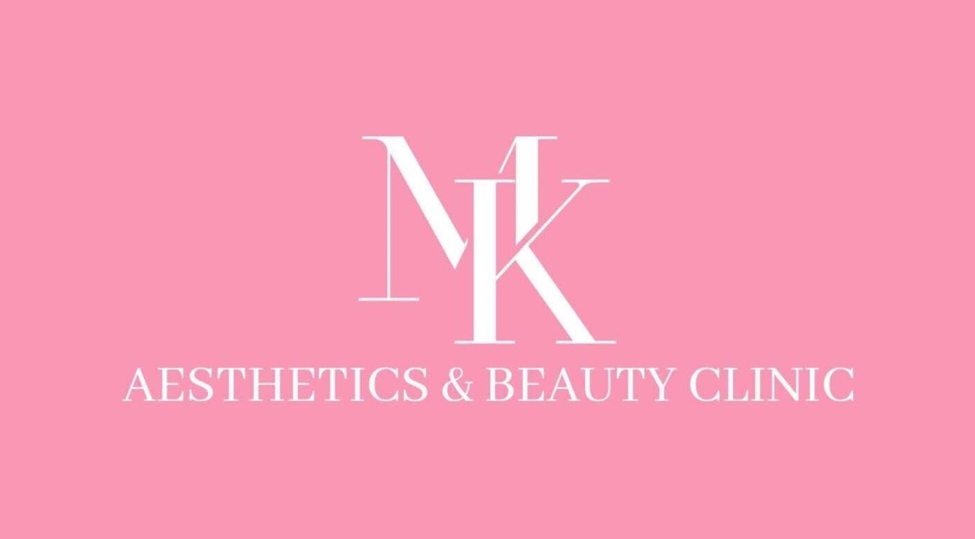 MK Aesthetics and Beauty Clinic logo set on a pink background in Birmingham, England, GB.