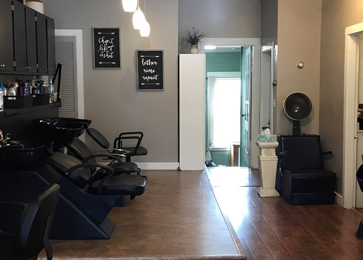 Scissor Excitement salon features sleek chairs and modern decor in Hampden, Maine, US.