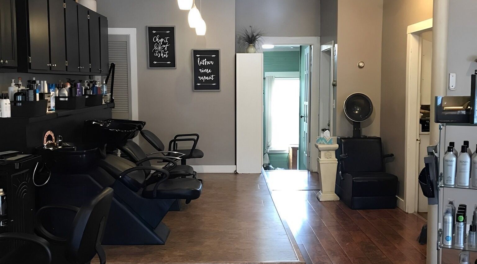 Scissor Excitement salon features sleek chairs and modern decor in Hampden, Maine, US.