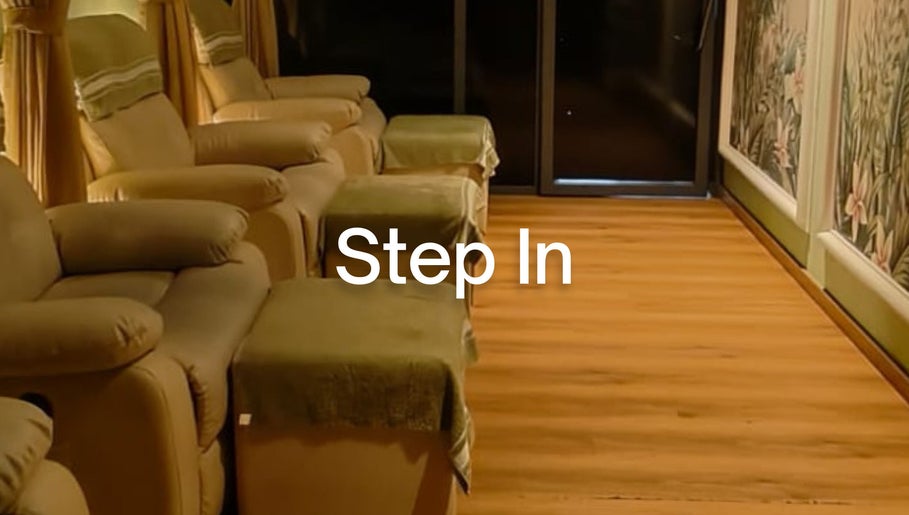 Relax Reflexology's serene lounge in Mumbai, Maharashtra, IN, featuring plush chairs and calming decor.