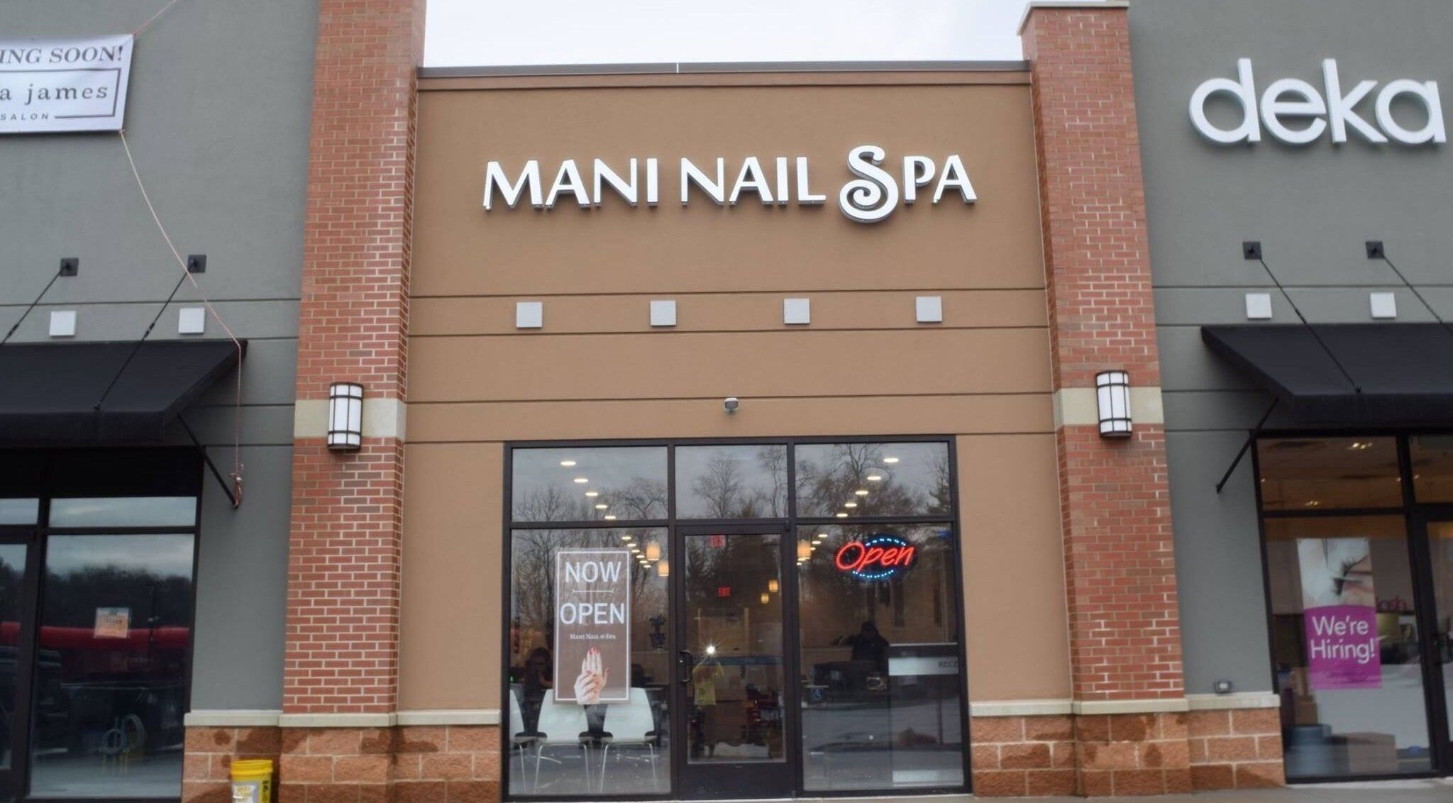 Exterior view of Mani Nails & Spa in Bethel Park, Pennsylvania, US, with open sign displayed.