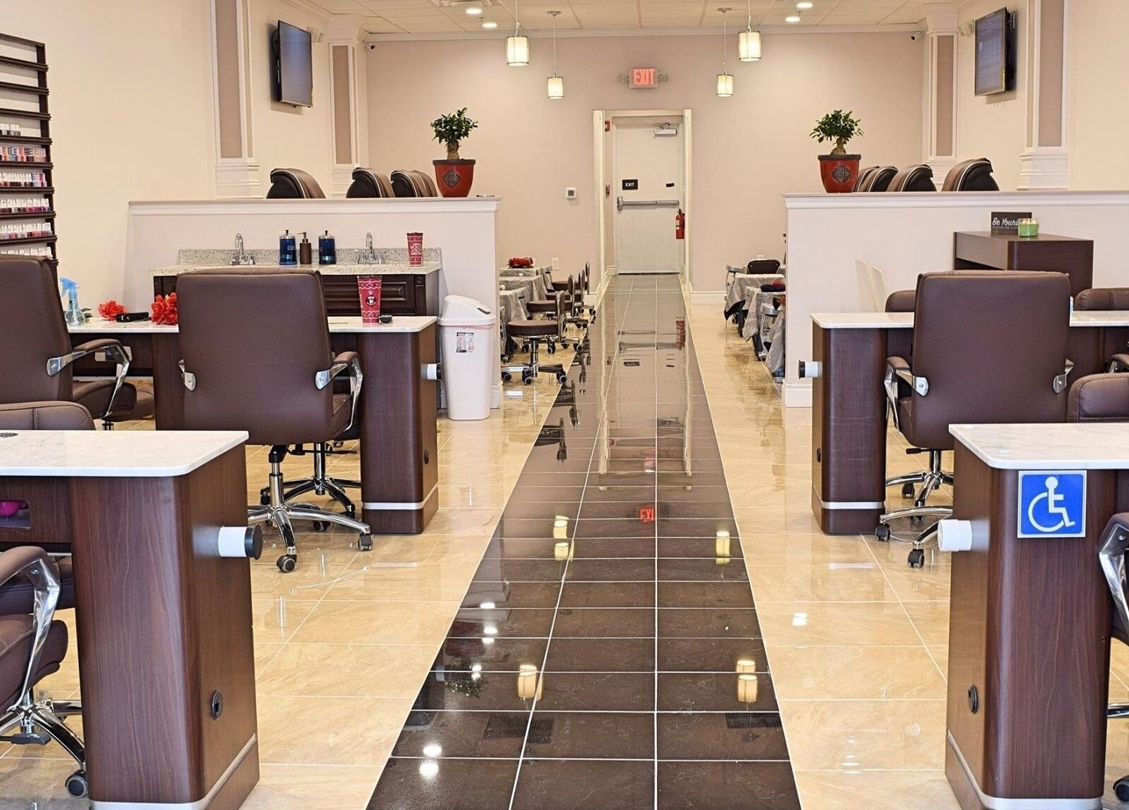 Modern interior of Mani Nails & Spa in Bethel Park, Pennsylvania featuring stylish seating and nail stations.