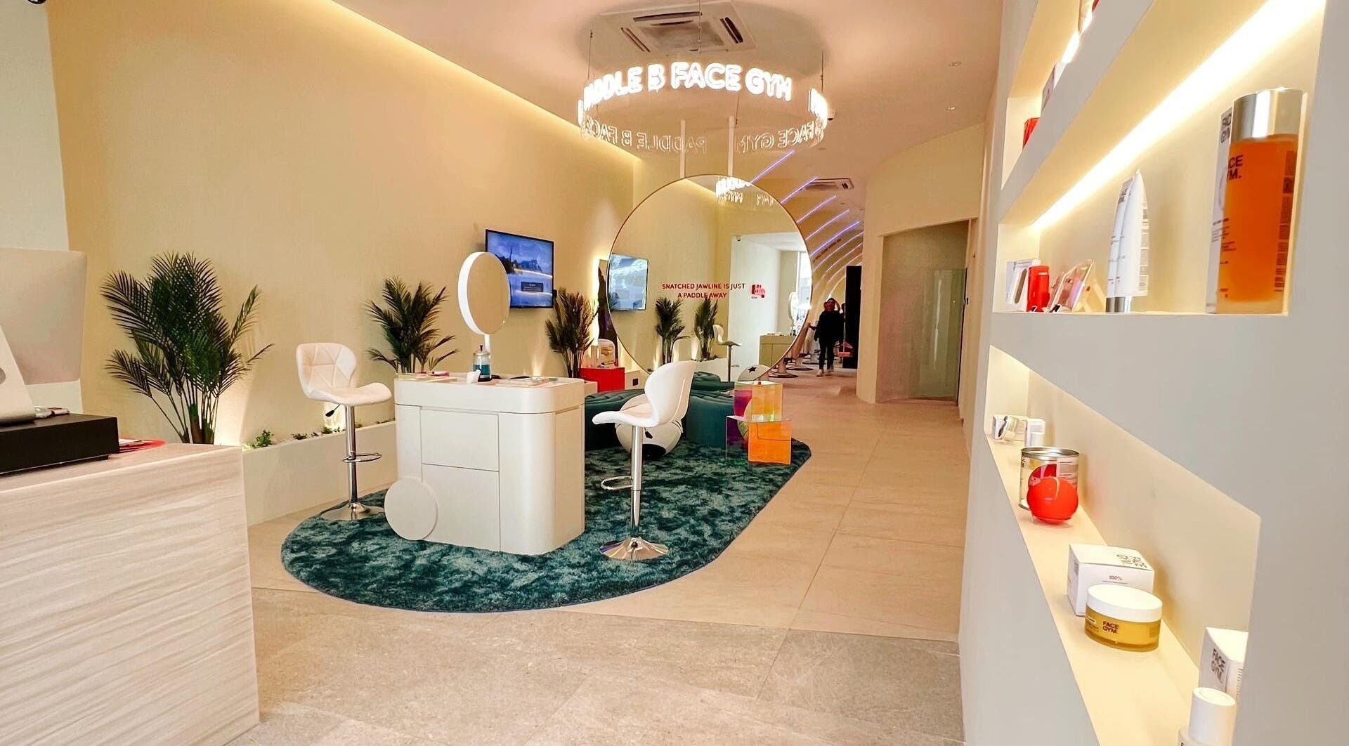 Modern interior of Paddle B Face Gym in Kuala Lumpur, featuring sleek design and beauty products on display.