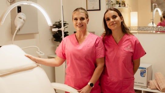 Staff in pink uniforms at Refresh and Reveal - PLUSH DIAMONDS, Roma, Queensland, AU ready to welcome clients.