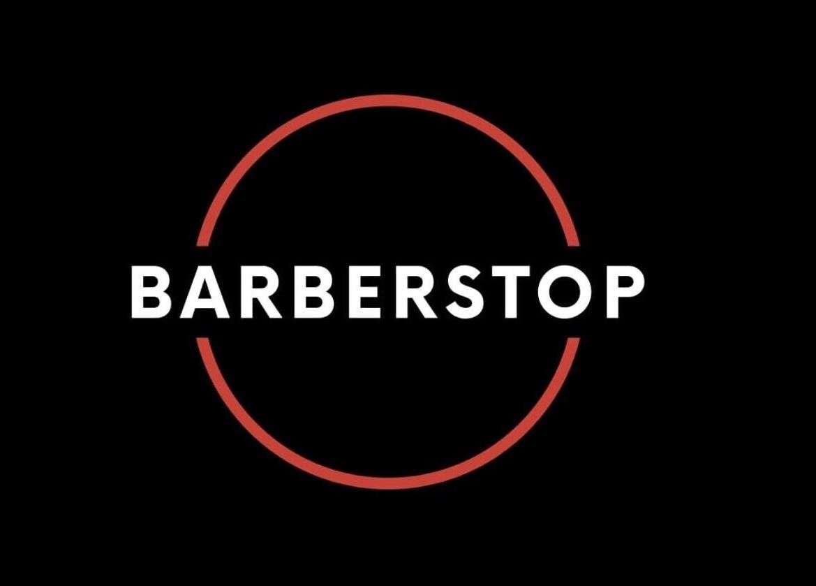 Elegant Barber Stop logo on black background, Birmingham, England, GB.