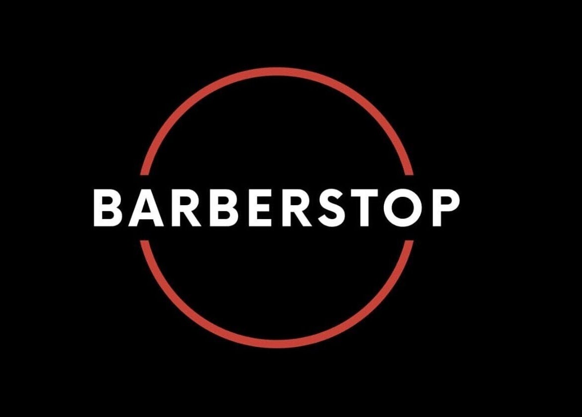 Elegant Barber Stop logo on black background, Birmingham, England, GB.
