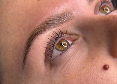 Close-up of perfectly groomed eyebrows and lashes at Brow House Syd, Hassall Grove, New South Wales, AU.