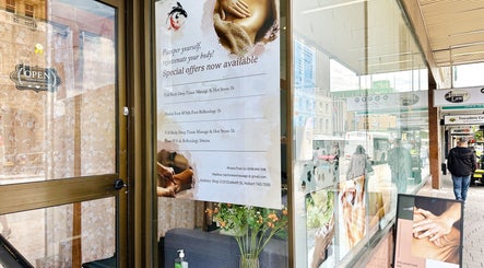 Entrance of Tai Chinese Traditional Massage, Hobart, Tasmania, AU with promotional signage.