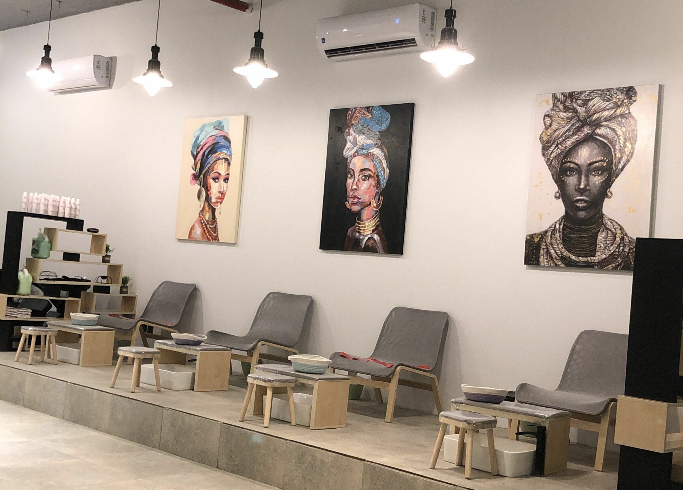 Modern lounge area at The Golden Hour, Riyadh, Riyadh Province, SA, with elegant chairs and vibrant artwork.