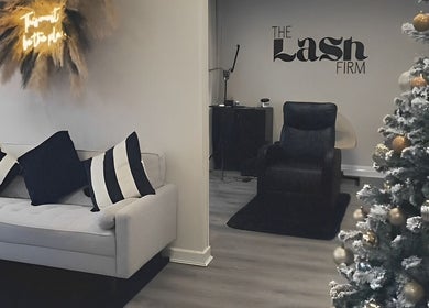 Cozy interior of The Lash Firm in Consett, England, GB with a modern sofa and festive decor.
