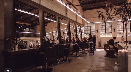 Interior of Shag High Voltage Hair, Port Elizabeth, Eastern Cape, ZA, showcasing modern hair styling stations.