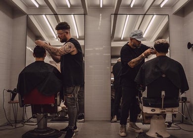 Barbers styling hair at Shag High Voltage Hair in Port Elizabeth, Eastern Cape, ZA.