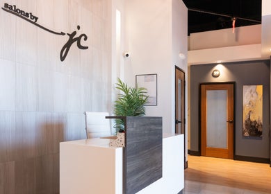 Chic reception area at Xo Beauty in North Wales, Pennsylvania, US featuring modern decor and a welcoming desk.