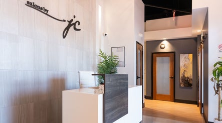 Chic reception area at Xo Beauty in North Wales, Pennsylvania, US featuring modern decor and a welcoming desk.