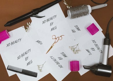 Beauty tools at Xo Beauty, North Wales, Pennsylvania, US showcasing styling essentials on a brown surface.