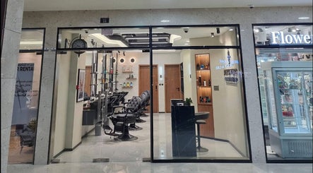 Elegant interior of Pitstop Barbers in Dubai, AE, featuring stylish chairs and grooming stations.