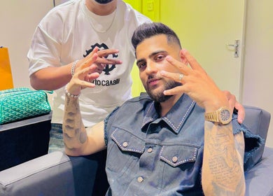 Guests at Pitstop Barbers in Dubai, AE enjoying a stylish gathering.