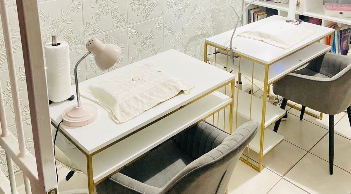 Chic manicure stations at Beauty4ashies Brow and Nail Bar in Kempton Park, Gauteng, ZA, featuring stylish decor.