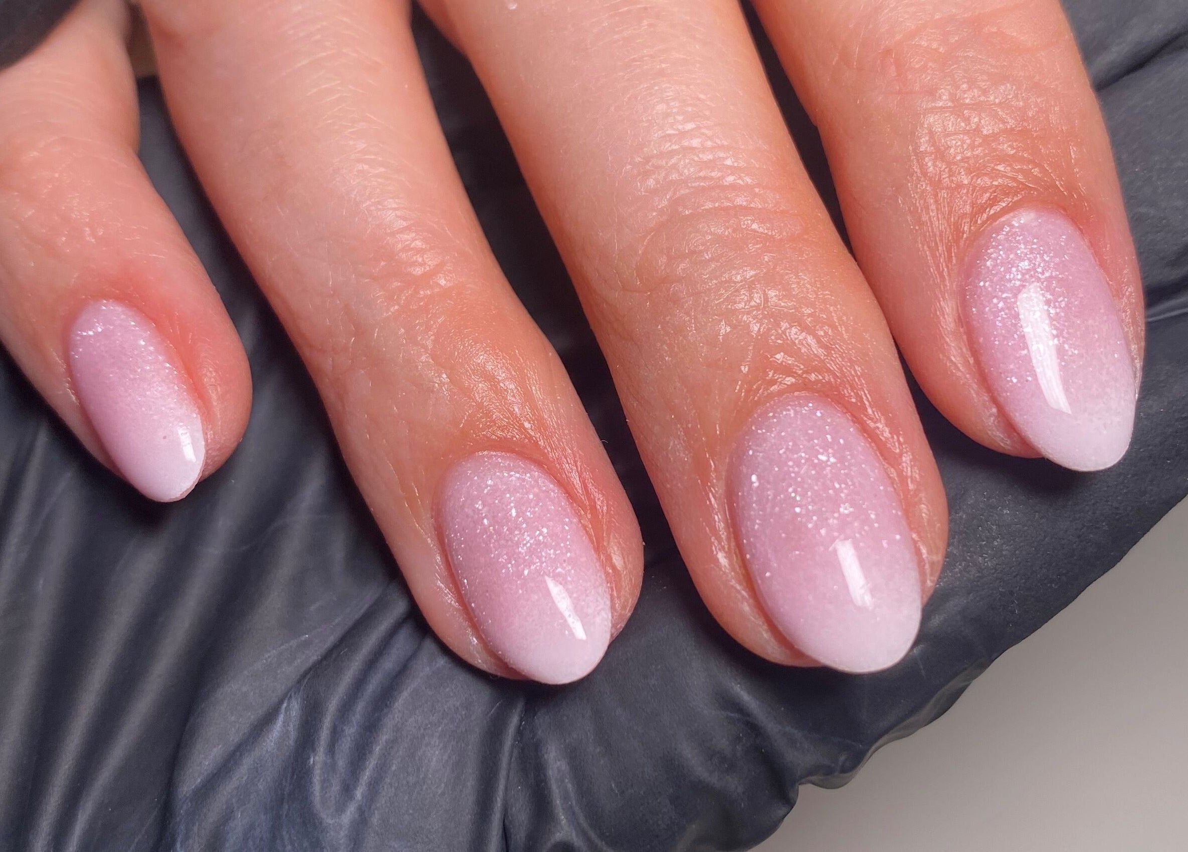 Elegant pink nails with glitter at The Nail Project by Deanna, Penicuik, Scotland, GB.