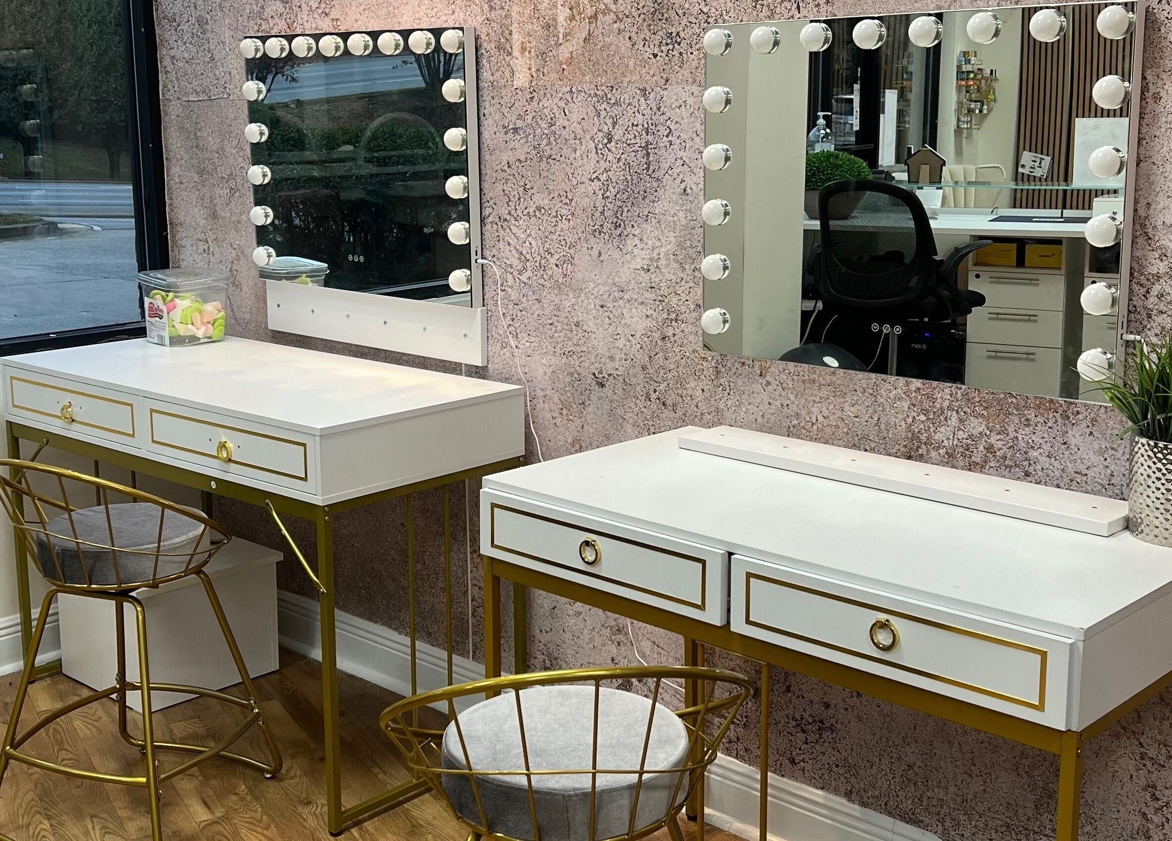 Elegant beauty stations inside Nia Soule Salon & Spa - Norcross, Georgia, US with mirrors and modern chairs.