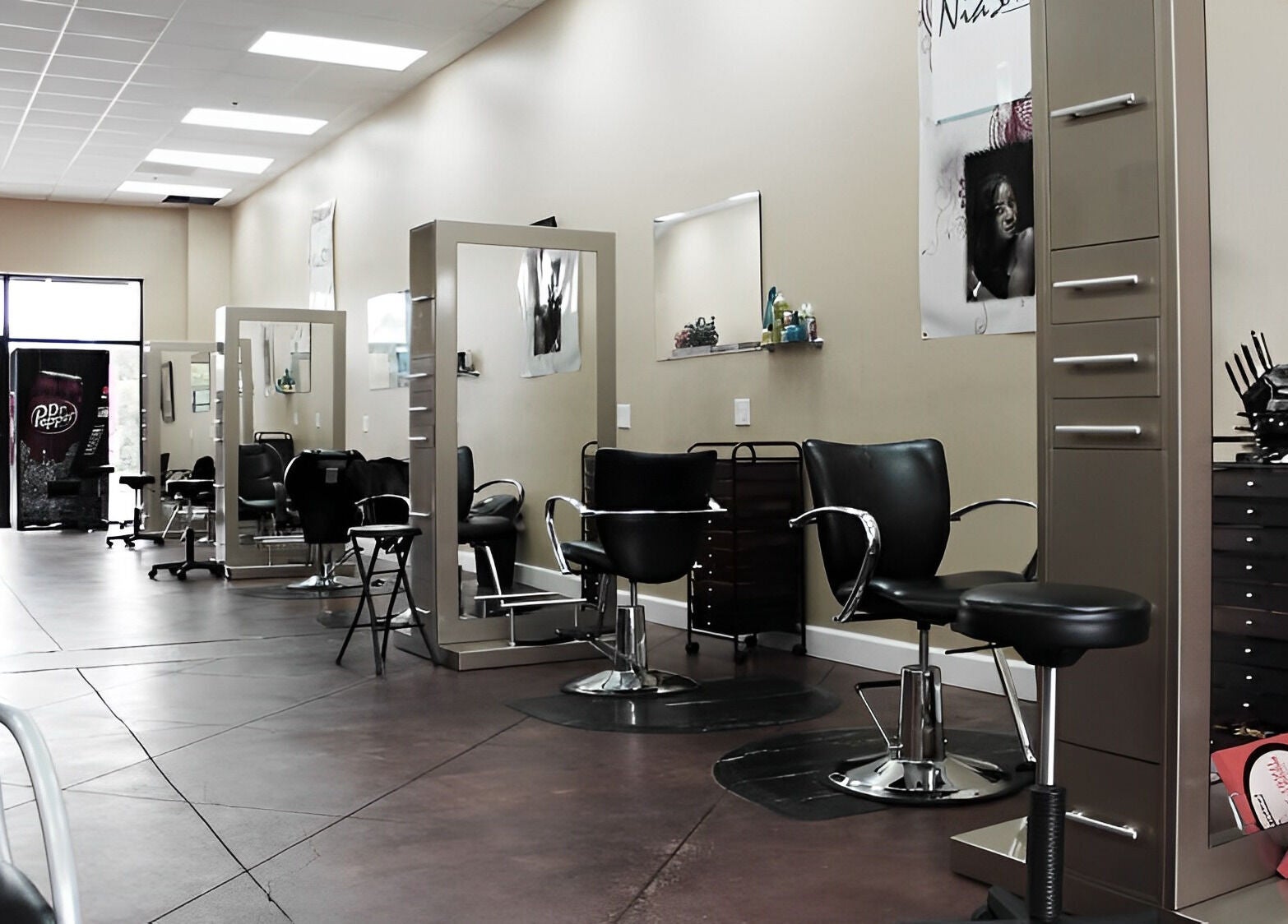 Modern interior of Nia Soule Salon & Spa - Norcross in Norcross, Georgia, US featuring sleek salon chairs and mirrors.