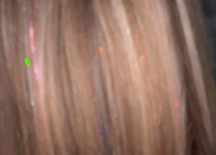 A close-up of shimmering hair highlights at Feud Nails, Cardiff, Wales, GB.