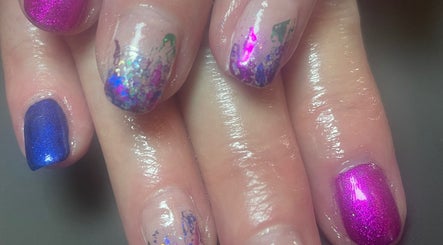 Vibrant nail art with shimmery polish at Bliss Home Beauty, Buntingford, England, GB.