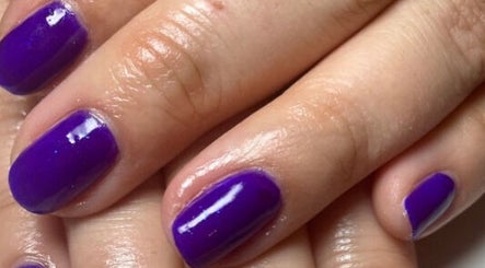 Close-up of vibrant purple manicure at Bliss Home Beauty, Buntingford, England, GB.