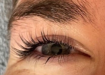 Closeup of eye with lush lashes at Bliss Home Beauty in Buntingford, England, GB.