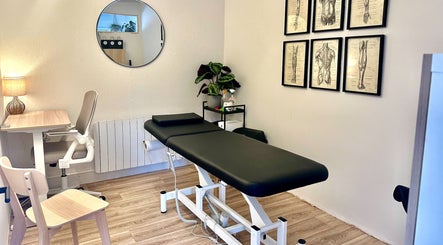 Cozy treatment room at Peak Performance Clinic Heart of the Shires, Daventry, England, GB, featuring a massage table.