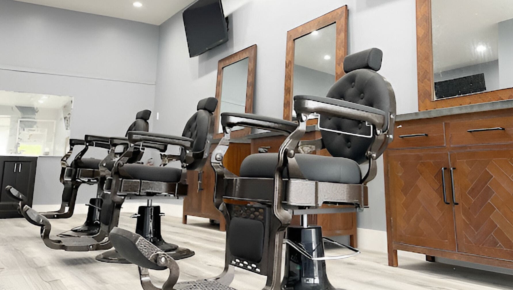 Modern barber chairs at HC Shave House in Burbank, California, US. Experience premium grooming.
