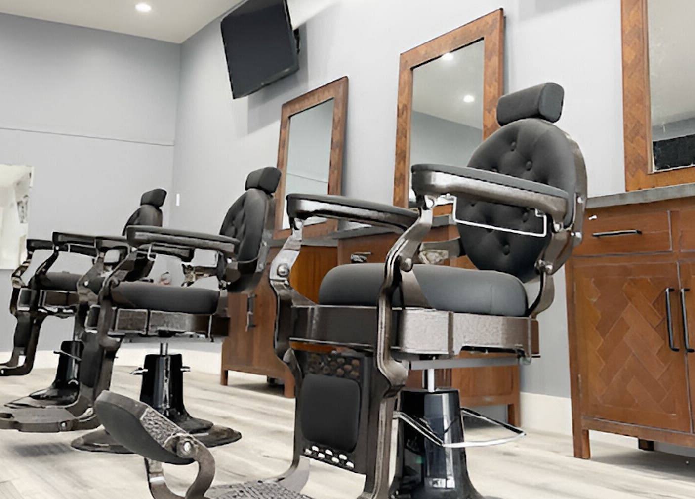 Modern barber chairs at HC Shave House in Burbank, California, US. Experience premium grooming.
